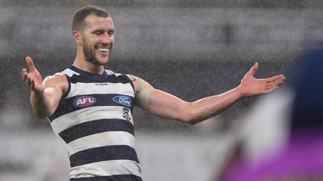 Sam Menegola celebrates a goal in the rain against Fremantle.