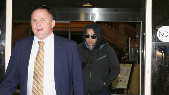 Alexander Anh Nguyen Tran, right, and his lawyer Tim Dibden, left, outside the District Court. Picture: Emma Brasier/AAP