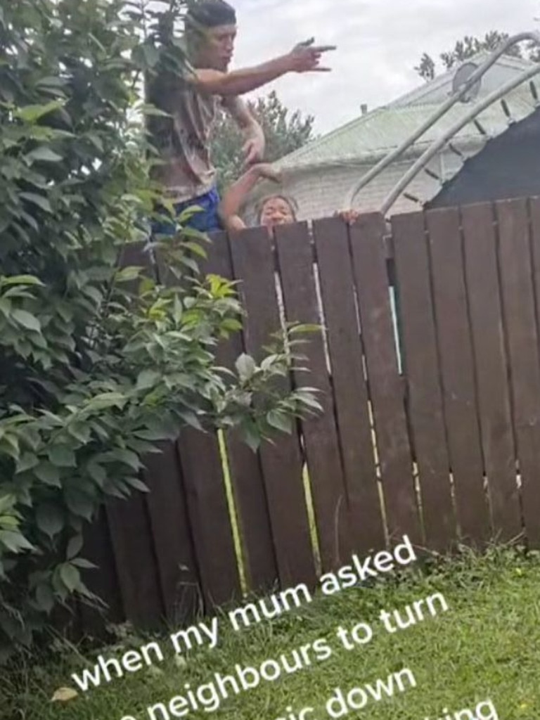 A man climbed onto the fence to hurl abuse at the grandmother. Picture: TikTok