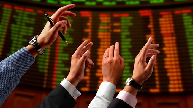 Share price, bull, bear, shares, stocks. Hands raised into the air and electronic stock market board.