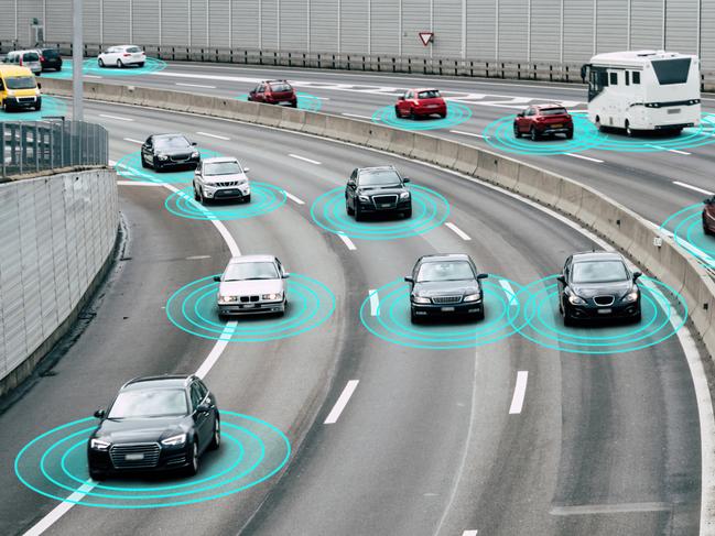 Illustration and photo of a autonomous self-driving cars driving on a highway. The cars are connected through wireless technology and artificial intelligence which enables them to drive on the road safely.