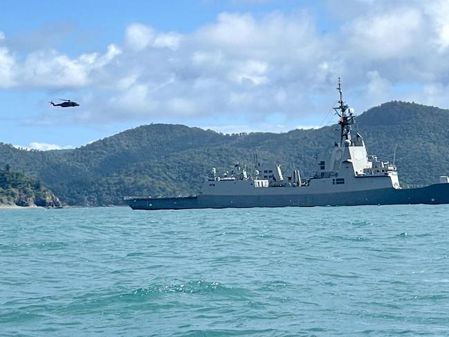 At sea, helicopters can be seen carrying debris while it's understood Police Boat Damian Leeding and a Volunteer Marine Rescue boat Midge Point have also retrieved debris.