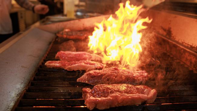 The supermarket steaks hit the grill at the Woolly Bay Hotel, Woolloomooloo. Picture: Justin Lloyd.