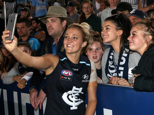 Jess Hosking of Carlton poses for a selfie with fans following the AFLW Round 1 match between the Carlton Blues and the Collingwood Magpies at Ikon Park, Melbourne, on Friday, February 2, 2018. (AAP Image/Hamish Blair) NO ARCHIVING, EDITORIAL USE ONLY