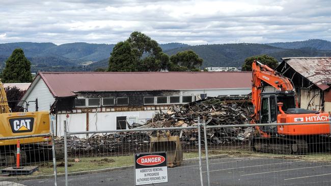 A building destroyed by fire at Cosgrove High has now been demolished, with some damage to the neighbouring building visible. Photo: Richard Stewart