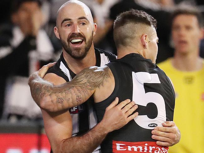 AFL First Qualifying Final.  06/09/2019 . Geelong vs Collingwood at the MCG .   Collingwood's Steele Sidebottom  and Jamie Elliott   celebrates a goal in the 1st quarter   . Pic: Michael Klein.