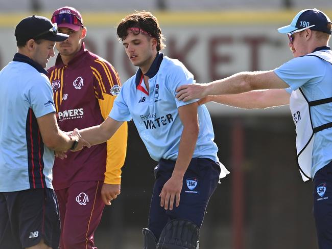 BRISBANE, AUSTRALIA - FEBRUARY 13: Sam Konstas of New South Wales is helped up by team mates after going down during the ODC match between Queensland and New South Wales at Allan Border Field, on February 13, 2025, in Brisbane, Australia. (Photo by Albert Perez/Getty Images)