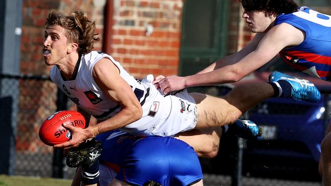 Joel Trudgeon fires out a handball for Northern Knights. Picture: Michael Klein