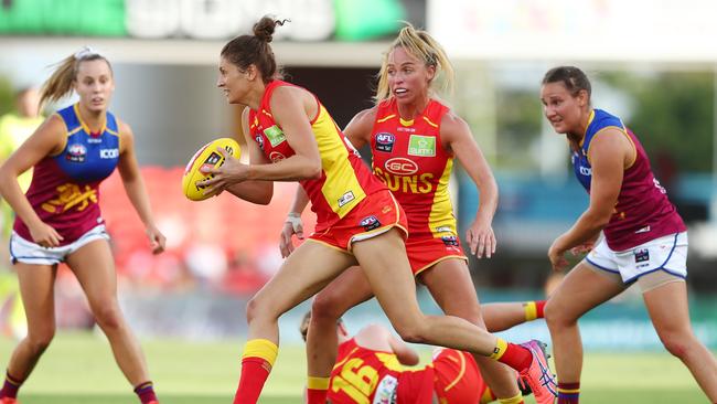 Jasmyn Hewett of the Suns handballs during the round three AFLW match between the Gold Coast Suns and the Brisbane Lions at Metricon Stadium on February 22, 2020 in Gold Coast, Australia. (Photo by Chris Hyde/Getty Images)