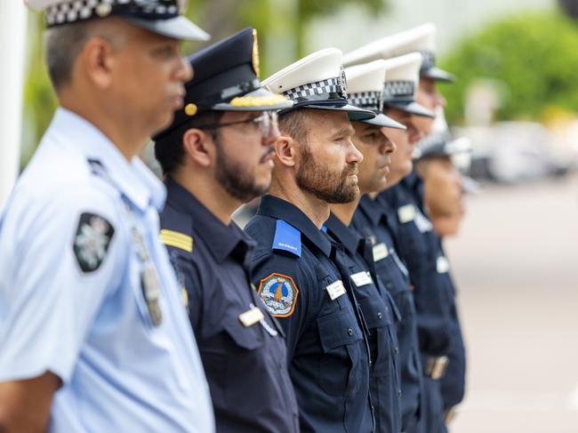 NT Police officers stand in honour of their fallen mates during Police Remembrance Day. Picture: Floss Adams.