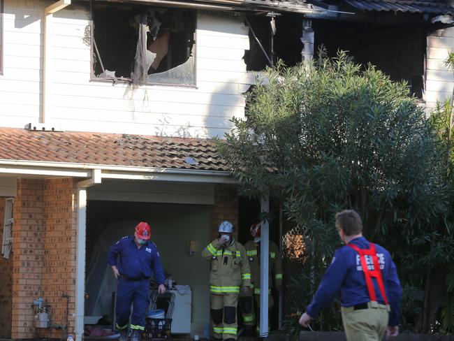 Emergency services outside fire damaged townhouse in Greenacre. Picture: John Grainger