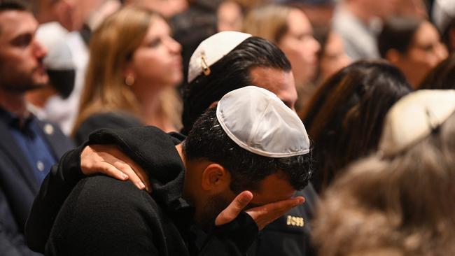 TOPSHOT - People attend a vigil for Israeli victims at the Stephen Wise Temple, in Los Angeles, California on October 8, 2023, after the Palestinian militant group Hamas launched an attack on Israel. Israel, reeling from the deadliest attack on its territory in half a century, formally declared war on Hamas October 8, 2023 as the conflict's death toll surged close to 1,000 after the Palestinian militant group launched a massive surprise assault from Gaza. (Photo by Robyn Beck / AFP)