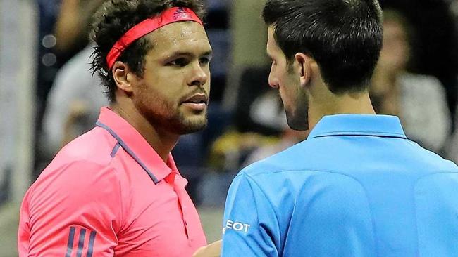 Novak Djokovic of Serbia (right) and Jo-Wilfried Tsonga of France at the net after Tsonga retired due to injury in their quarter-final at the US Open. Picture: JUSTIN LANE