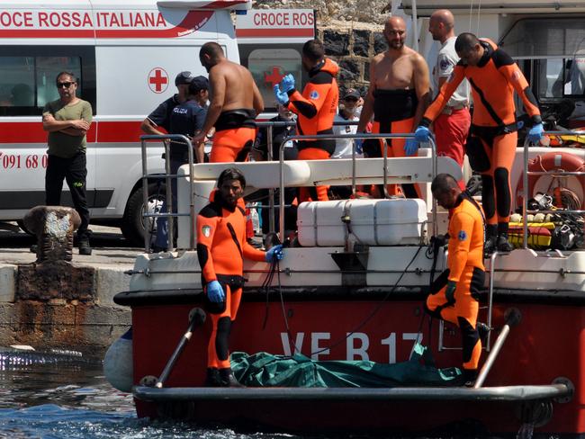 Divers recover the body of Hannah Lynch, the last person missing after the tragedy. Picture: AFP