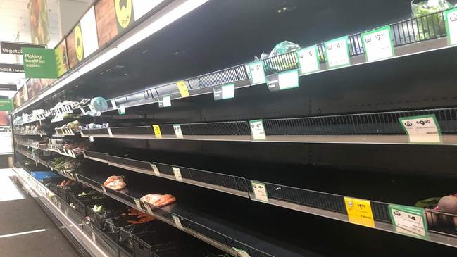 Fruit and veg shelves have been stripped bare at a Sydney Woolworths amid supply chain issues. Picture: Supplied