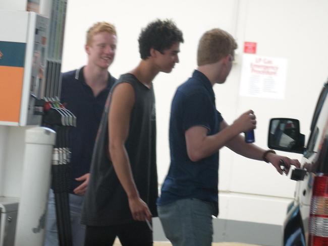 Calum Hood smoking at the bowser / Picture: Jayden Seyfarth
