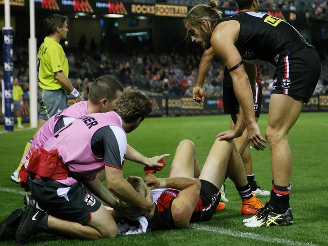 Nick Riewoldt lies on the turf after being flattened by Tom Bugg. Picture: George Salpigtidis