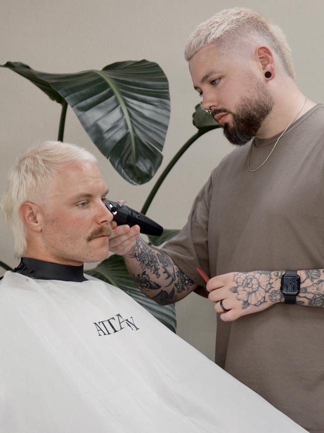 Attaboy barber Tom Wynn working on Formula 1's Valtteri Bottas. Picture: supplied