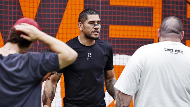 DAILY TELEGRAPH - 12.2.25UFC Light Heavyweight champion Alex Pereira (middle wearing black) visits GWS Giants HQ in Homebush today before leaving unexpectedly. Picture: Sam Ruttyn