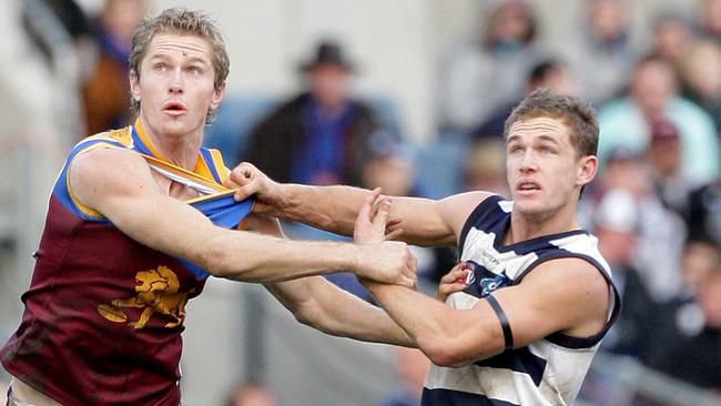 Troy Selwood (letf) and his brother Joel Selwood contest. The Selwood family hold the AFL record for the most games played by a set of brothers.