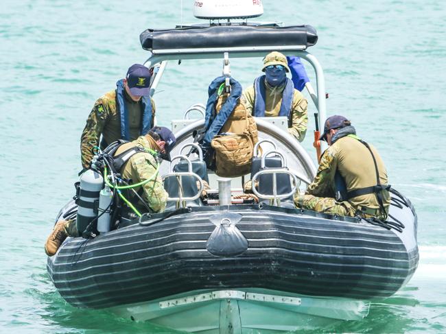 ADF divers work on recovering a World War II era UXO from Darwin Harbour at the site of the proposed ship lift. Picture: Glenn Campbell