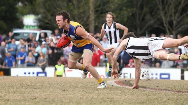 Craig Anderson avoids a tackle, proving he always was a hard man to bring down. Picture: Supplied.