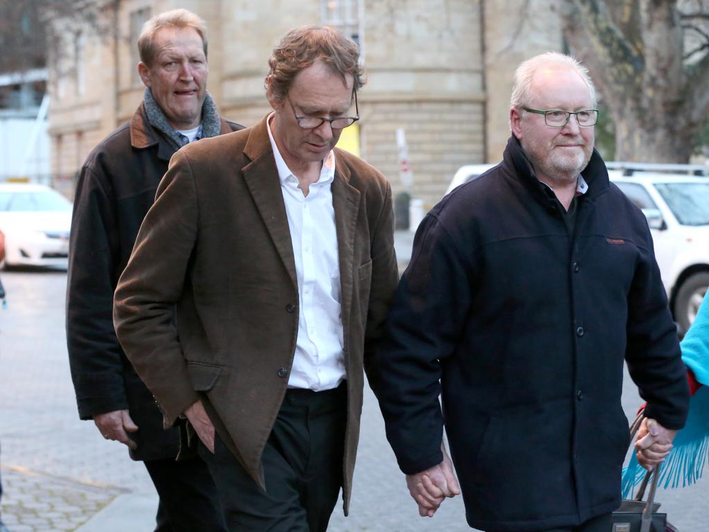 Stephen Edwards (centre) leaving the Supreme Court of Tasmania after being granted bail over the alleged murder of his mother. Picture: Nikki Davis-Jones