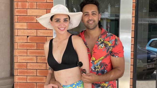 Pegah Shafiei (left) with her partner Ali Nedaee (right) who have come from Hoppers Crossing in Melbourne to holiday in Cairns talk fuel prices. Picture: Yashee Sharma