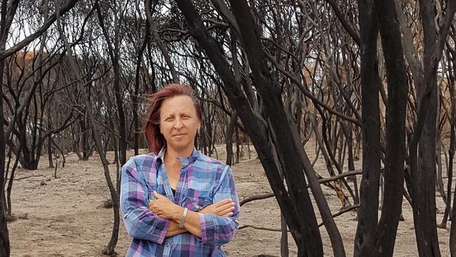 Kangaroo Island resident Margi Prideaux on her burnt-out property after the bushfires. Picture Supplied