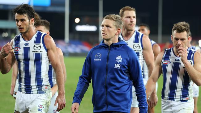 Jack Ziebell leads North Melbourne off after its loss to Richmond on Saturday night.