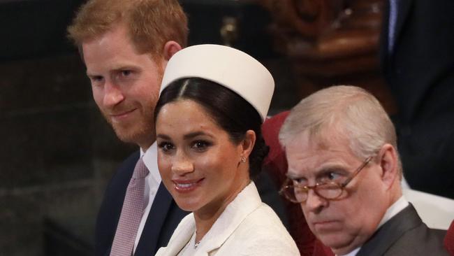 Meghan, Duchess of Sussex with Prince Harry, left, and Prince Andrew, right. Picture: AP Photo/Kirsty Wigglesworth/Pool