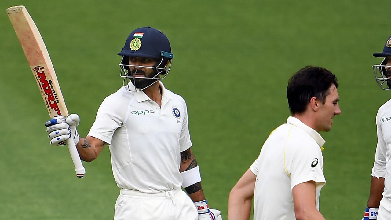 India's batsman Virat Kohli celebrates reaching his half century.