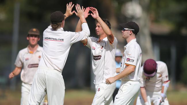 Kensington’s John Dalton and Cameron Fatchen celebrate a wicket. Picture: AAP/Dean Martin