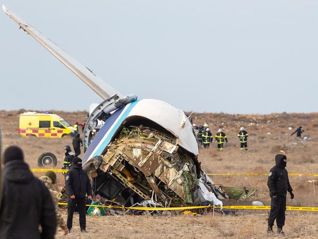 Emergency specialists work at the crash site of an Azerbaijan Airlines passenger jet near the western Kazakh city of Aktau on December 25, 2024. Picture: AFP