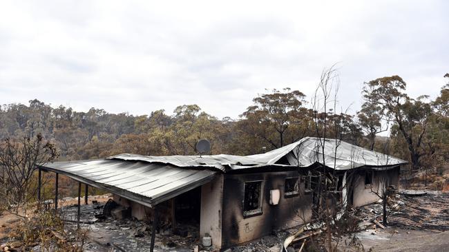 A house damaged by the catastrophic bushfires in the Southern Highlands village of Balmoral, 120km south west of Sydney, Monday, December 23, 2019. Picture: Mick Tsikas/AAP