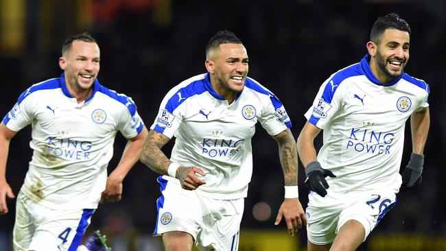 CORRECTION - Leicester City's Algerian midfielder Riyad Mahrez (R) celebrates scoring his team's first goal with Leicester City's English midfielder Danny Drinkwater and Leicester City's English defender Danny Simpson (C) during the English Premier League football match between Watford and Leicester City at Vicarage Road Stadium in Watford, north of London on March 5, 2016. / AFP / OLLY GREENWOOD / RESTRICTED TO EDITORIAL USE. No use with unauthorized audio, video, data, fixture lists, club/league logos or 'live' services. Online in-match use limited to 75 images, no video emulation. No use in betting, games or single club/league/player publications. / CORRECTION - Correcting identity “The erroneous mention[s] appearing in the metadata of this photo by OLLY GREENWOOD has been modified in AFP systems in the following manner: [Leicester City's Algerian midfielder Riyad Mahrez (R) celebrates scoring his team's first goal with Leicester City's English midfielder Danny Drinkwater and Leicester City's English defender Danny Simpson (C) during the English Premier League football match between Watford and Leicester City at Vicarage Road Stadium in Watford, north of London on March 5, 2016.] instead of [Leicester City's Algerian midfielder Riyad Mahrez (R) celebrates scoring his team's first goal with Leicester City's English midfielder Danny Drinkwater and Leicester City's Ghanaian midfielder Daniel Amartey (C) during the English Premier League football match between Watford and Leicester City at Vicarage Road Stadium in Watford, north of London on March 5, 2016.]. Please immediately remove the erroneous mention[s] from all your online services and delete it (them) from your servers. If you have been authorized by AFP to distribute it (them) to third parties, please ensure that the same actions are carried out by them. Failure to promptly comply with these instructions will entail liability on your part for any continued or post notification usage. Therefore we thank you