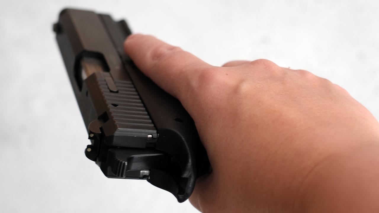 File image of a 9mm Glock in a woman's hand. iStock.