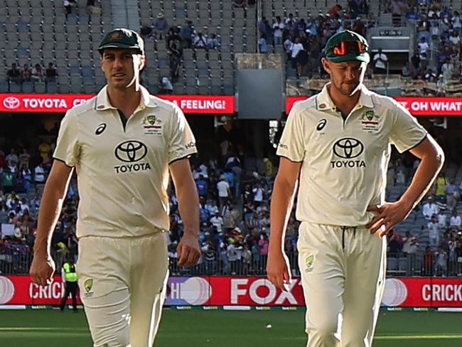 PERTH, AUSTRALIA - NOVEMBER 23: Marnus Labuschagne, Pat Cummins and Josh Hazlewood of Australia walk off the field at the end of play on day two of the First Test match in the series between Australia and India at Perth Stadium on November 23, 2024 in Perth, Australia. (Photo by Robert Cianflone/Getty Images)