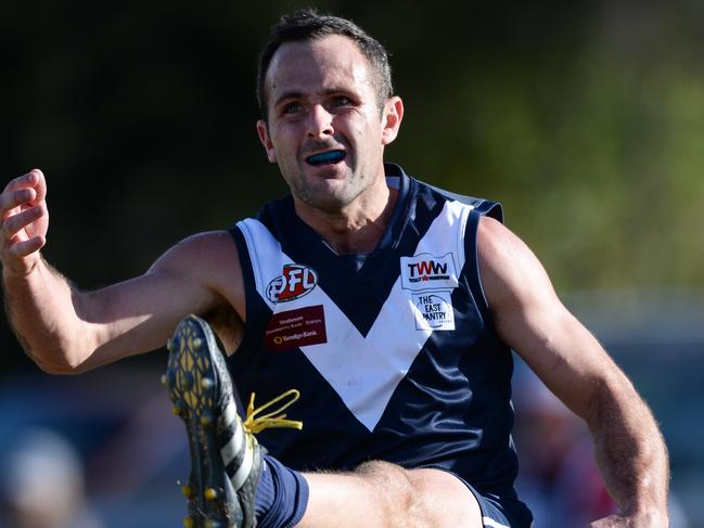 Avondale Heights skipper Mathew Cravino gets a kick away. Picture: Chris Eastman