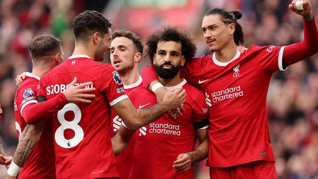 LIVERPOOL, ENGLAND - OCTOBER 21: Mohamed Salah of Liverpool celebrates with teammates after scoring the team's first goal during the Premier League match between Liverpool FC and Everton FC at Anfield on October 21, 2023 in Liverpool, England. (Photo by Jan Kruger/Getty Images)