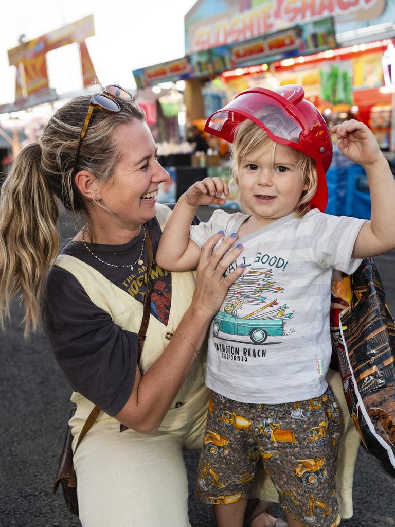 Kathleen Leggatt with son Koa Koland, 3, in sideshow alley at the Toowoomba Royal Show, Thursday, March 30, 2023. Picture: Kevin Farmer