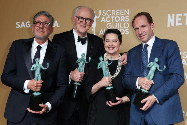 'Conclave' cast members (L-R) Sergio Castellitto, John Lithgow, Isabella Rossellini and Ralph Fiennes celebrate the film's win for best cast in a motion picture at the Screen Actors Guild Awards