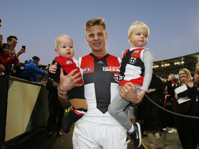 Nick Riewoldt walks down the race with sons James and William after playing his final game. Picture: Michael Klein