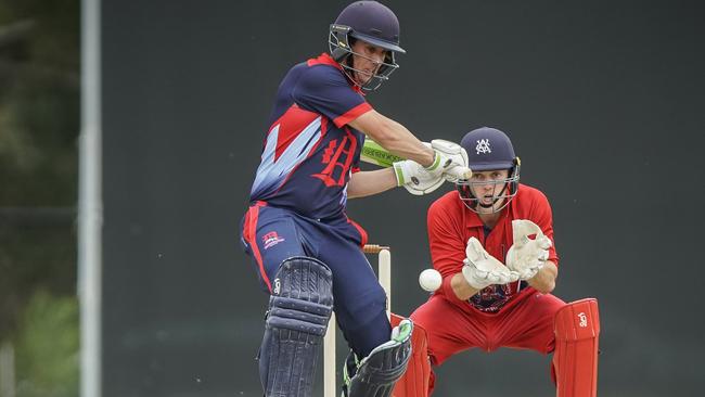 Premier Cricket: Melbourne v Dandenong. Dandenong batsman Tom Donnell and Melbourne keeper Sebastian Gotch. Picture: Valeriu Campan