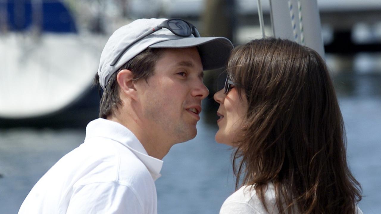 Prince Frederik kisses Mary Donaldson at the Royal Yacht Club of Tasmania in Hobart, two decades before her ascension to the throne.