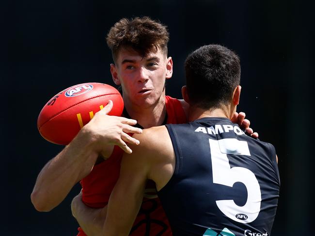 MELBOURNE, AUSTRALIA - FEBRUARY 22: Hugh Boxshall of the Saints is tackled by Adam Cerra of the Blues during the 2025 AFL match simulation between the Carlton Blues and St Kilda Saints at Ikon Park on February 22, 2025 in Melbourne, Australia. (Photo by Michael Willson/AFL Photos via Getty Images)