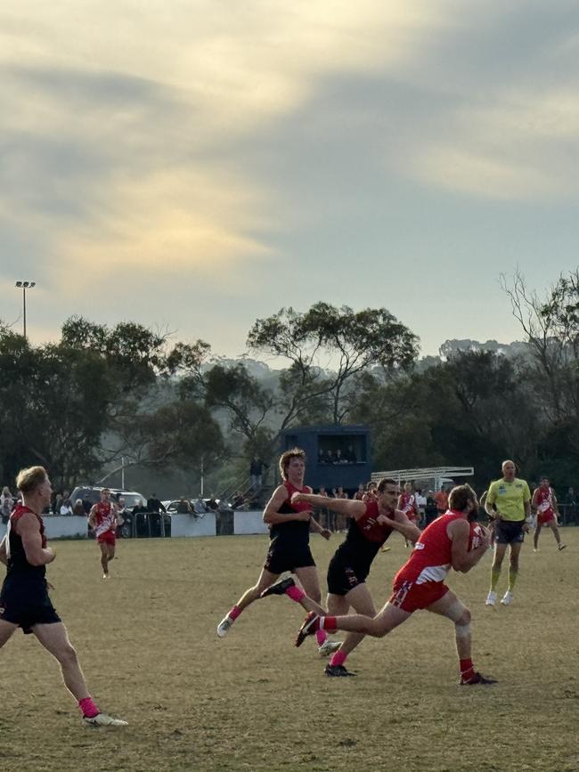 Leigh Poholke takes a mark in the final minute of the game.