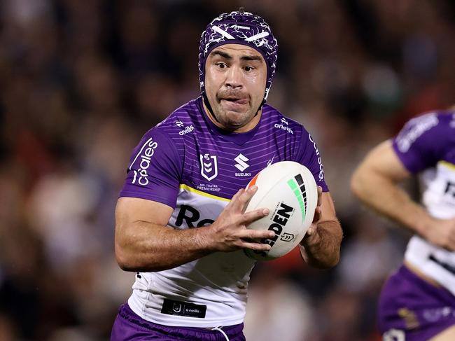 PENRITH, AUSTRALIA - AUGUST 15: Jahrome Hughes of the Storm runs the ball during the round 24 NRL match between Penrith Panthers and Melbourne Storm at BlueBet Stadium, on August 15, 2024, in Penrith, Australia. (Photo by Brendon Thorne/Getty Images)