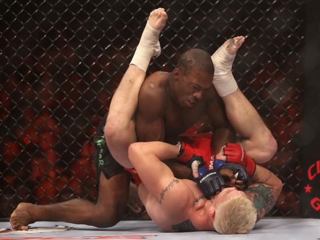 PHOENIX - AUGUST 13: Louis Taylor (top) battles with Joe Riggs during the Strikeforce Challengers Men's Main card bout at Dodge Theater on August 13, 2010 in Phoenix, Arizona. (Photo by Christian Petersen/Getty Images)