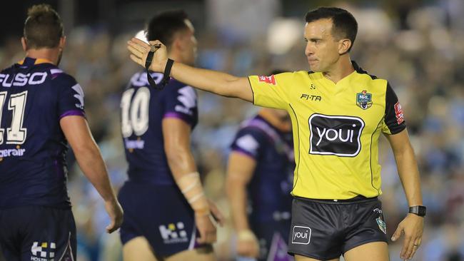 Referee Matt Cecchin awards a penalty to the Sharks. (Mark Evans/Getty Images)